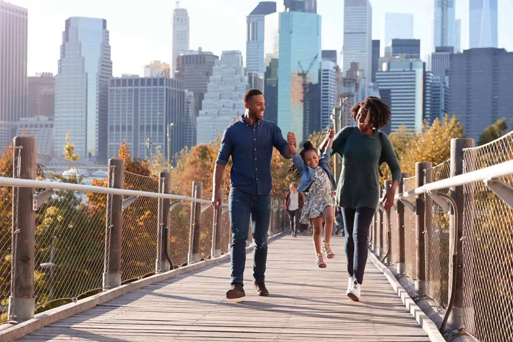 Family walking across bridge