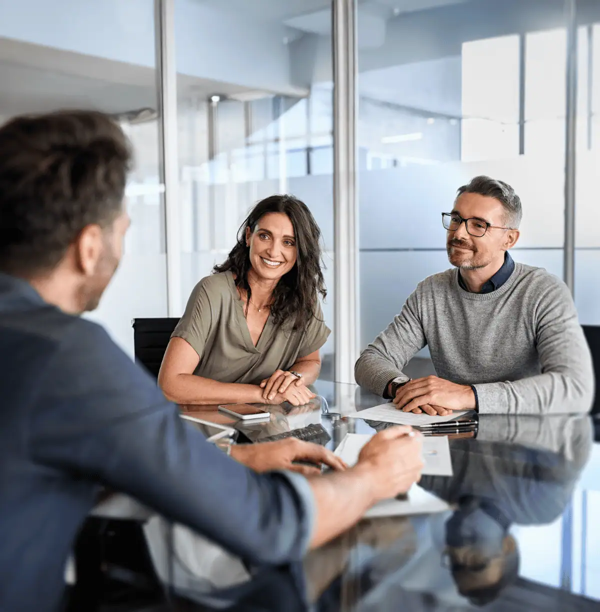 People around a desk in an office building