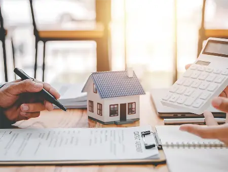 writing on a clipboard with calculator in view