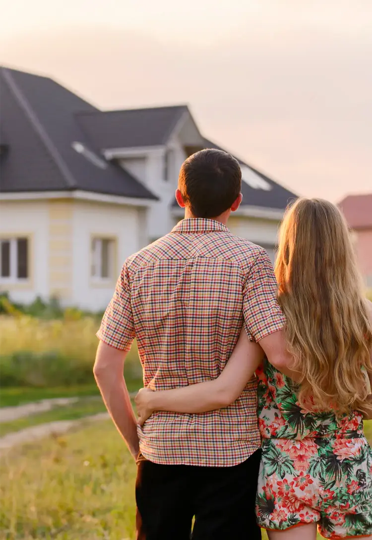 couple outside looking at home