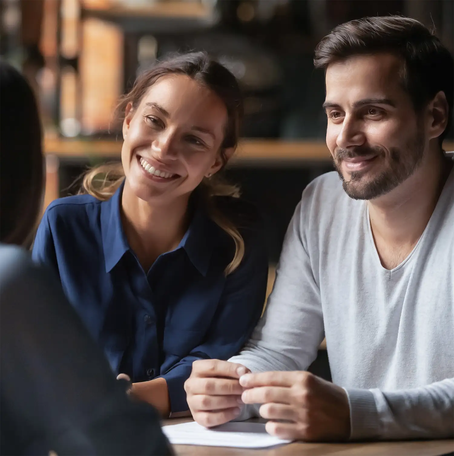 couple speaking with an agent