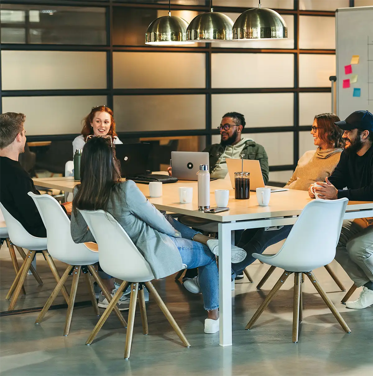 group of coworkers sitting around a table