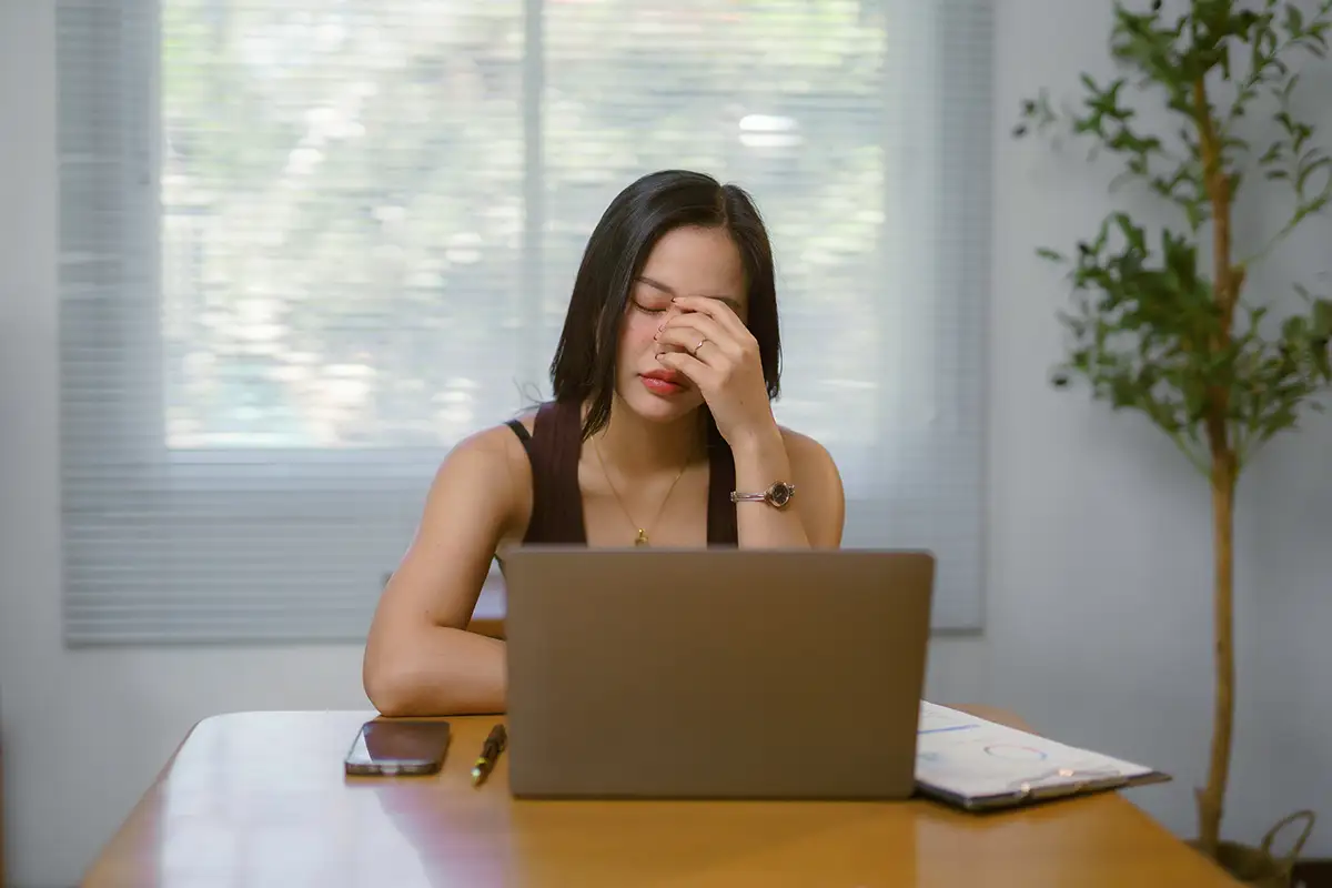 stressed out woman at laptop