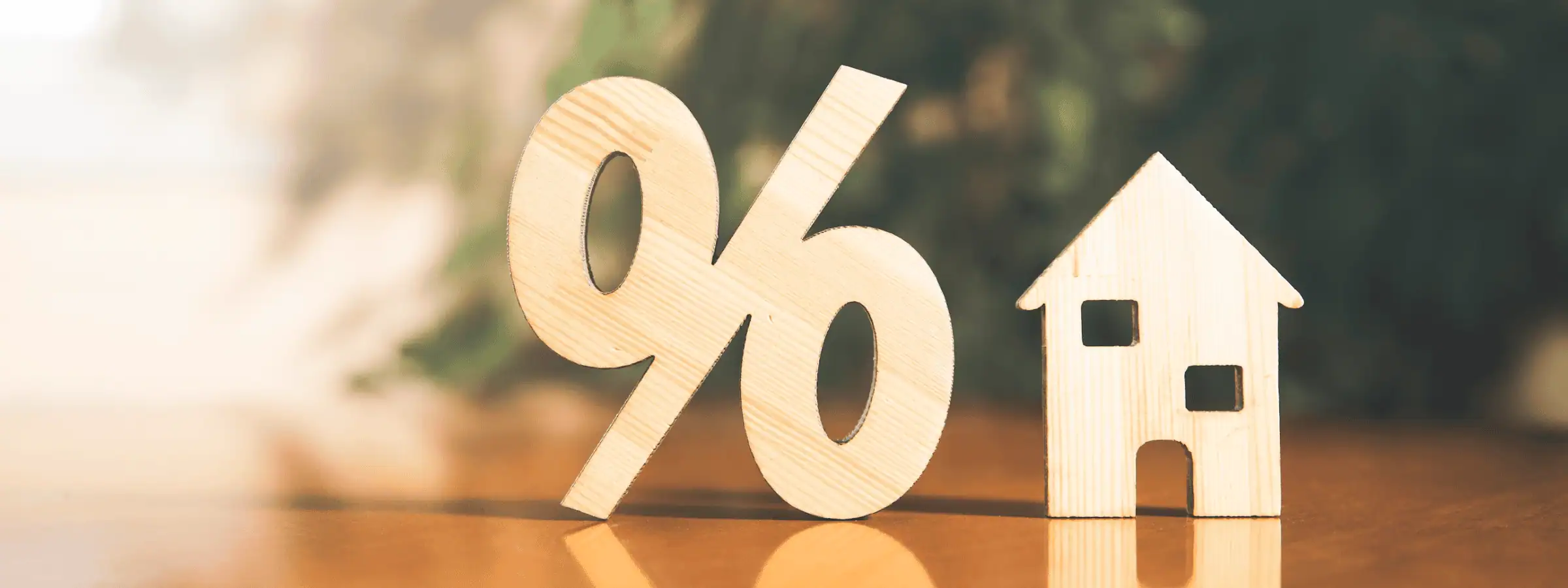 wooden carved percent symbol and home
