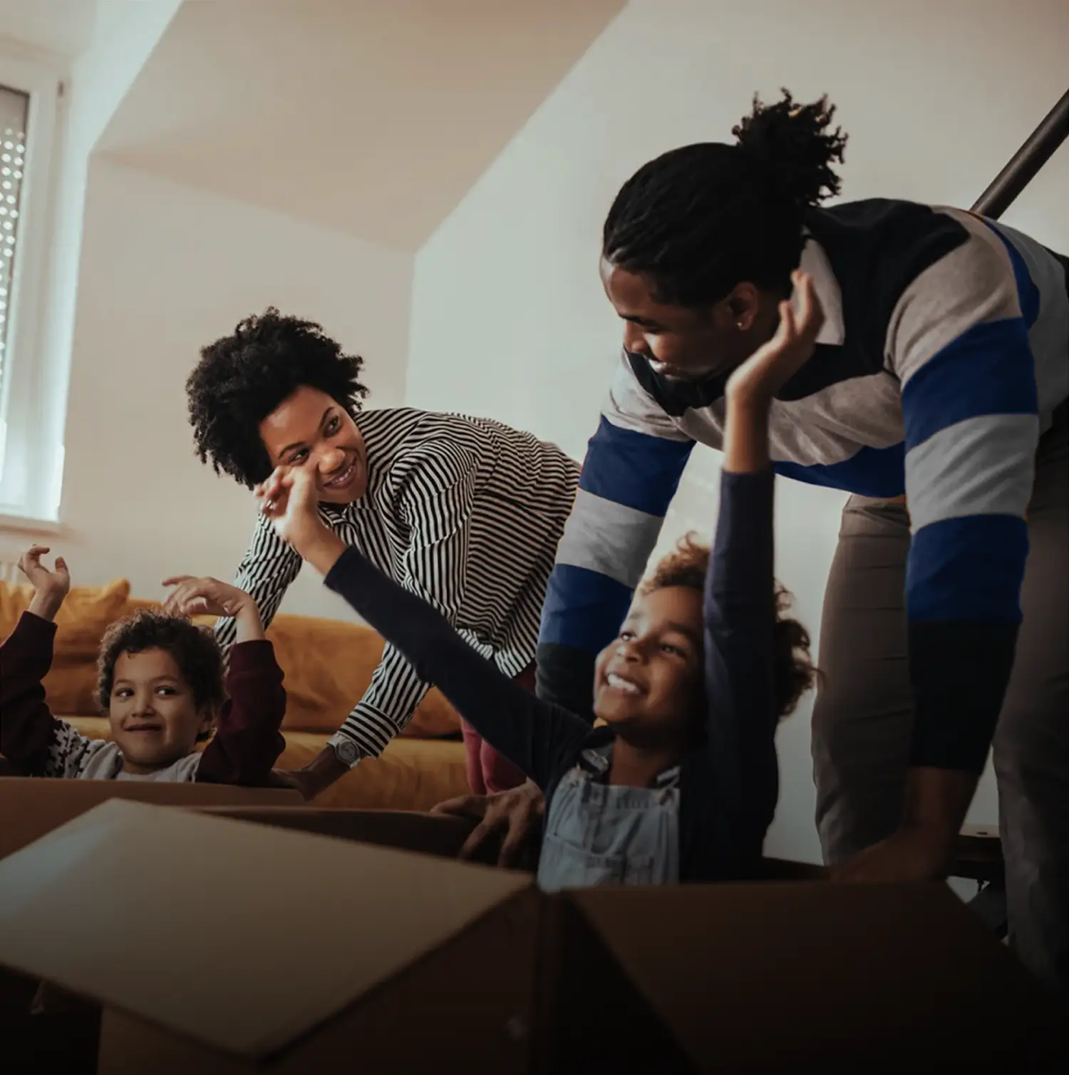 kids playing in cardboard boxes
