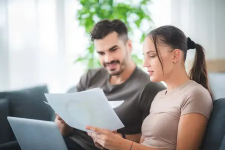 A couple signing documents