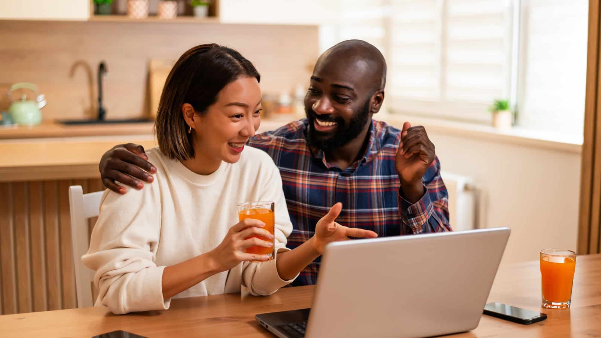 A couple looking at a laptop