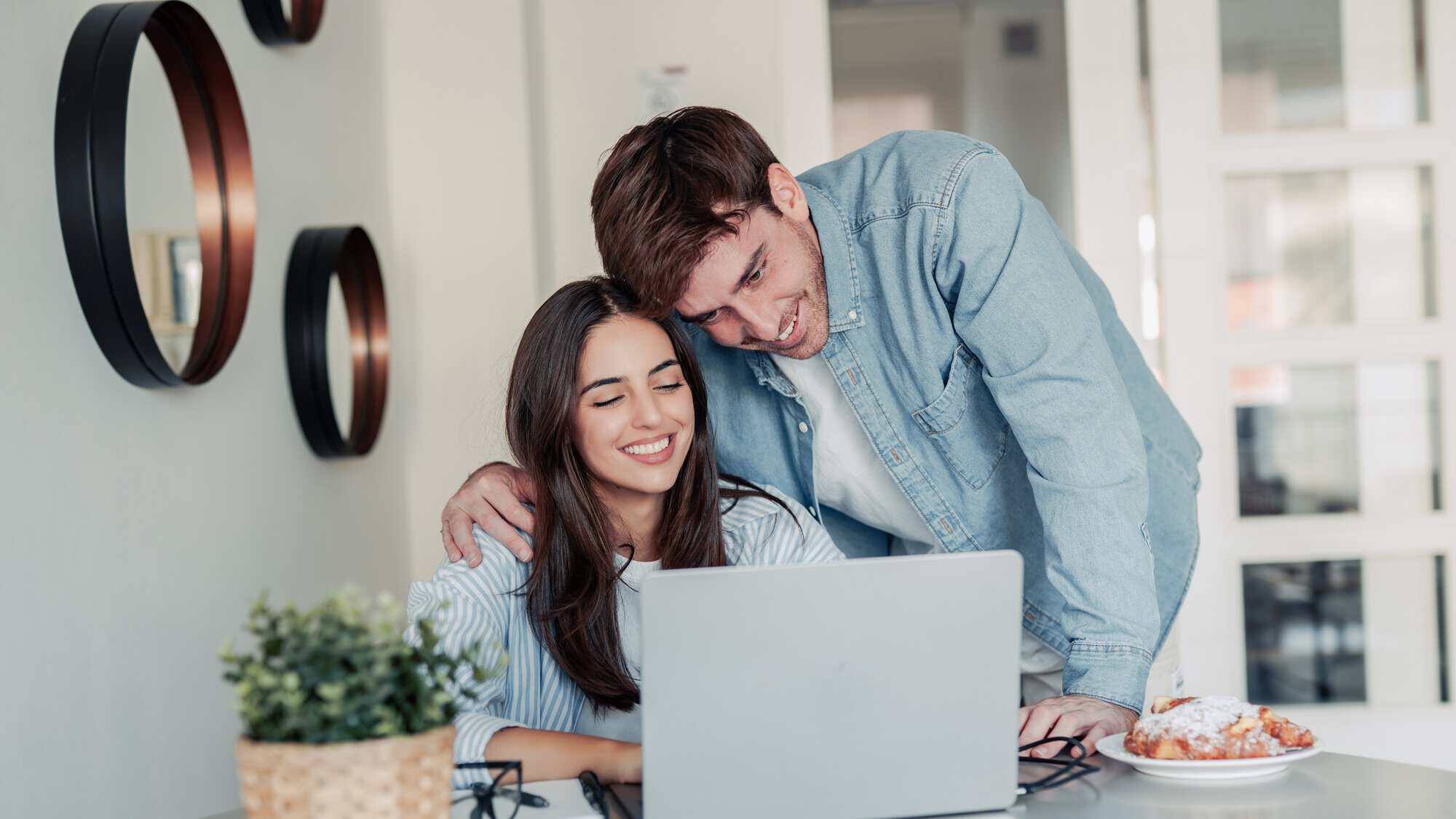A couple looking at a laptop