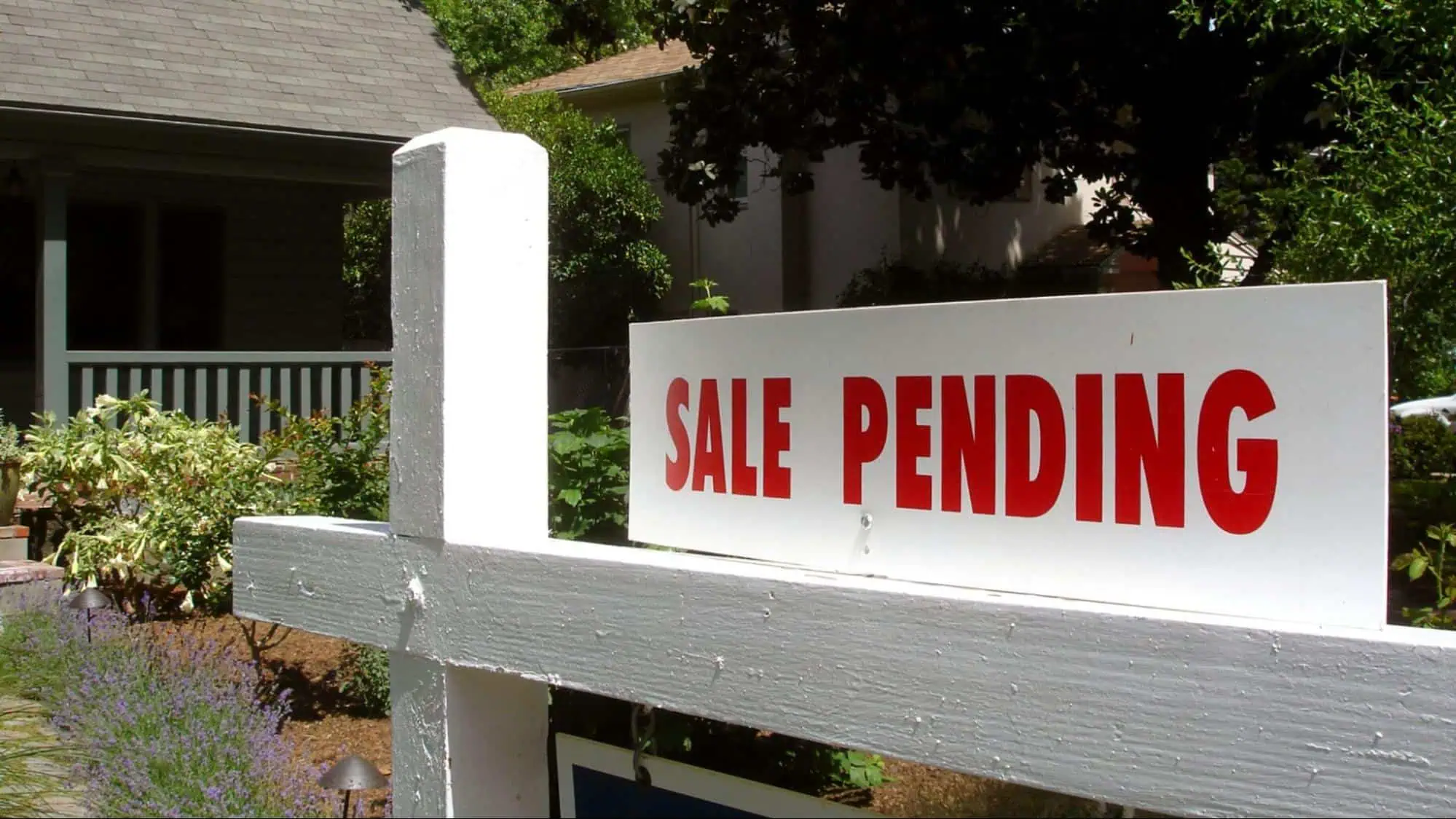Sale Pending Sign in front of house