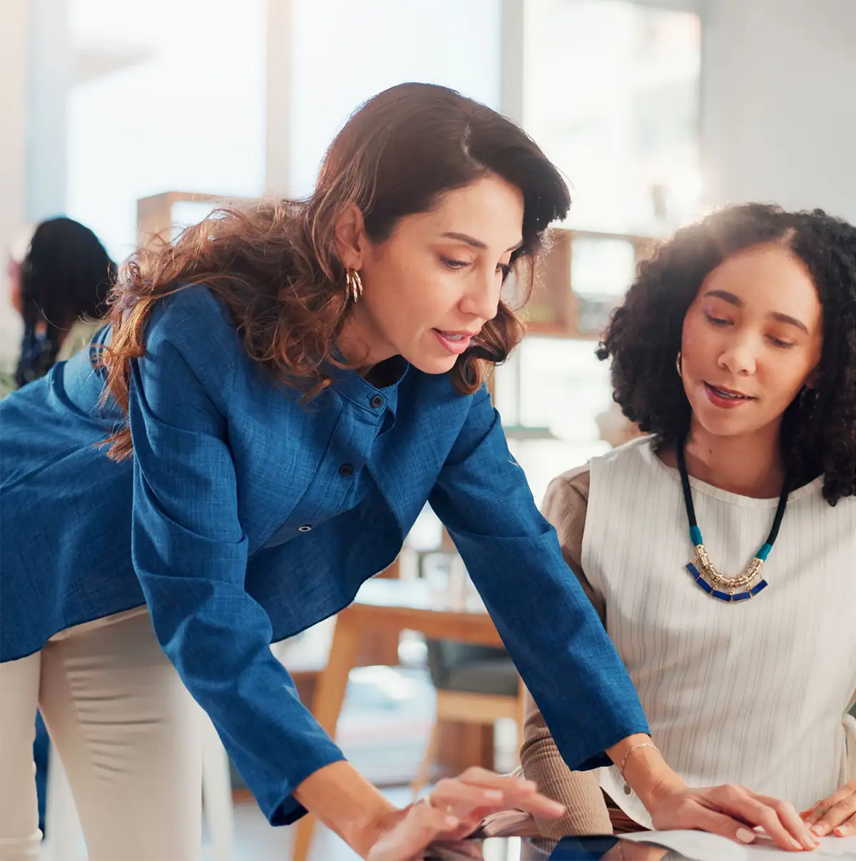 two women working together