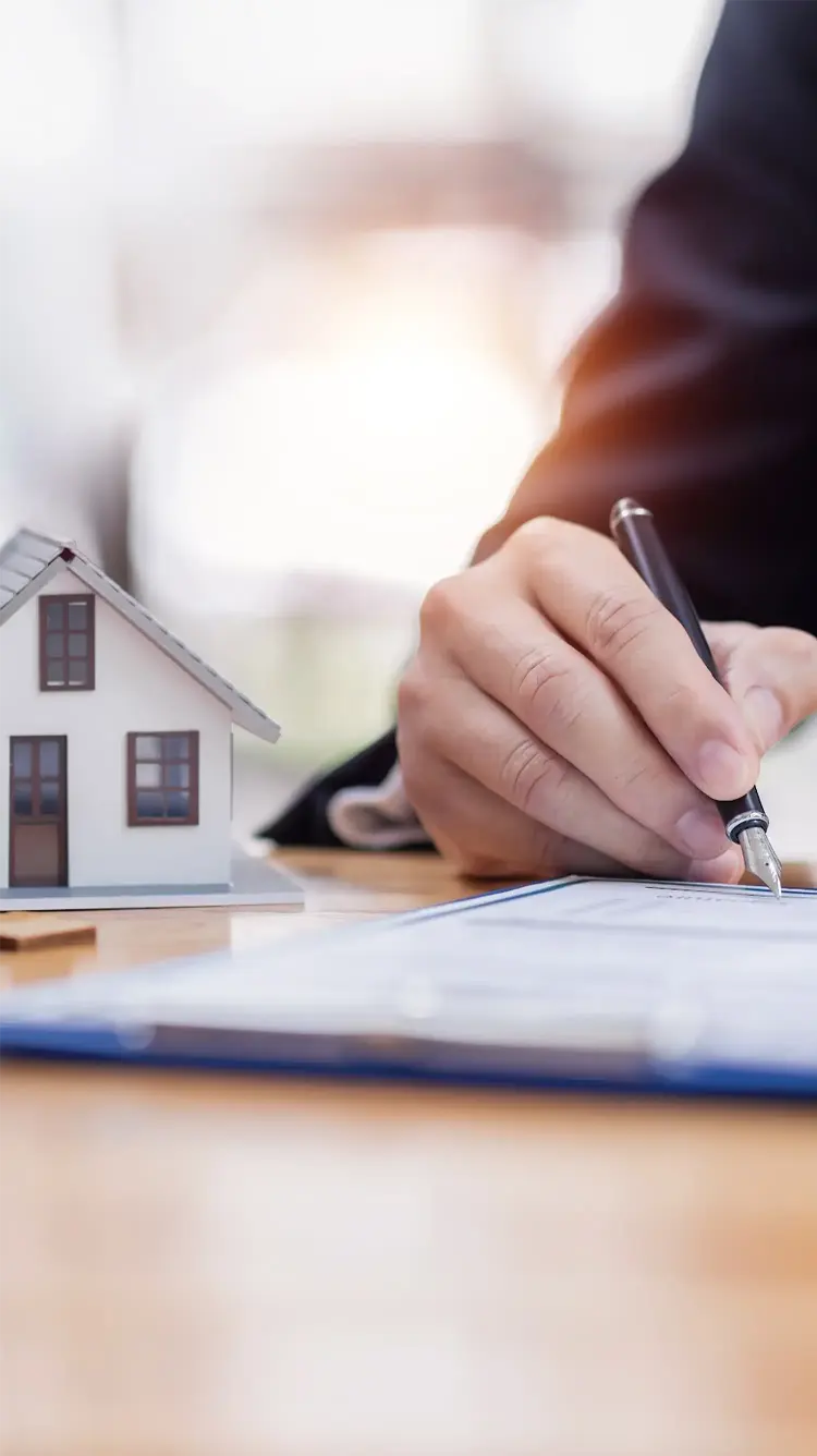 home next to writing on a clipboard