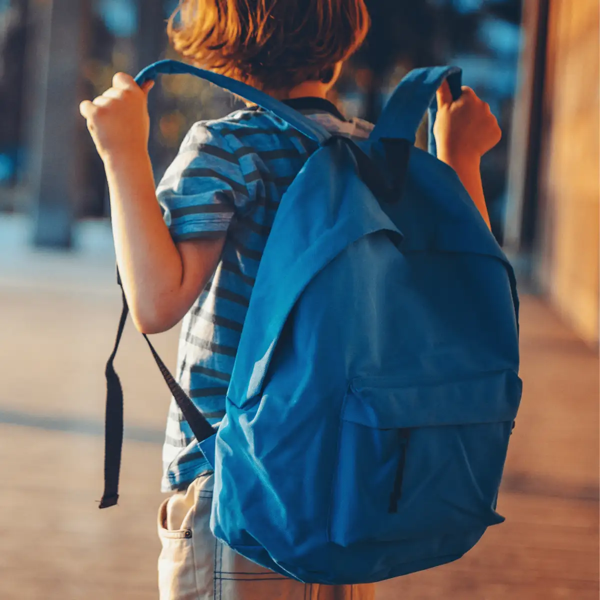 child with backpack