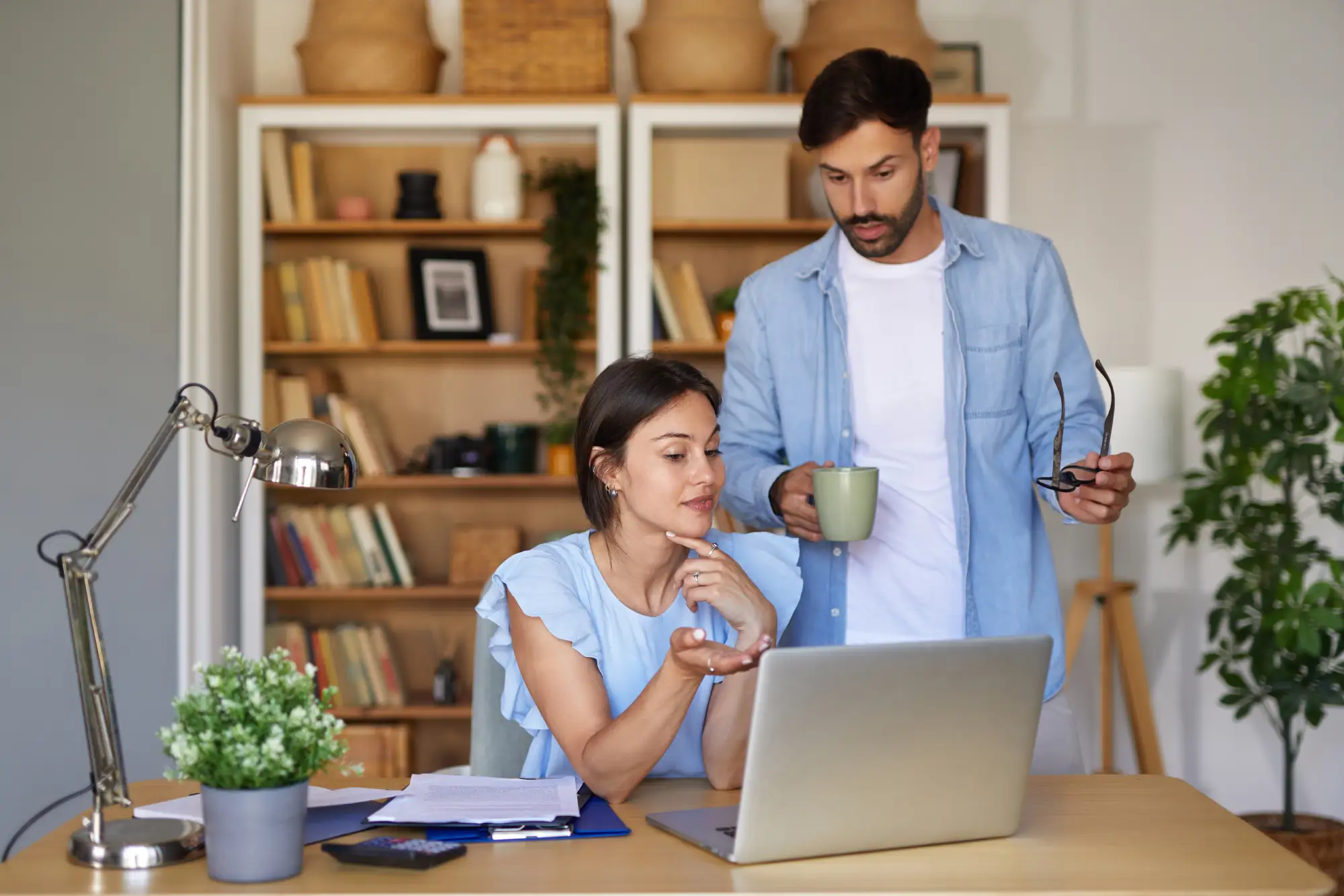 couple talking at laptop