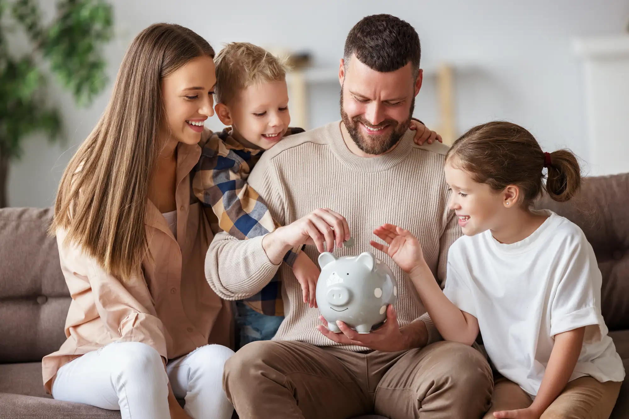 family saving with piggy bank