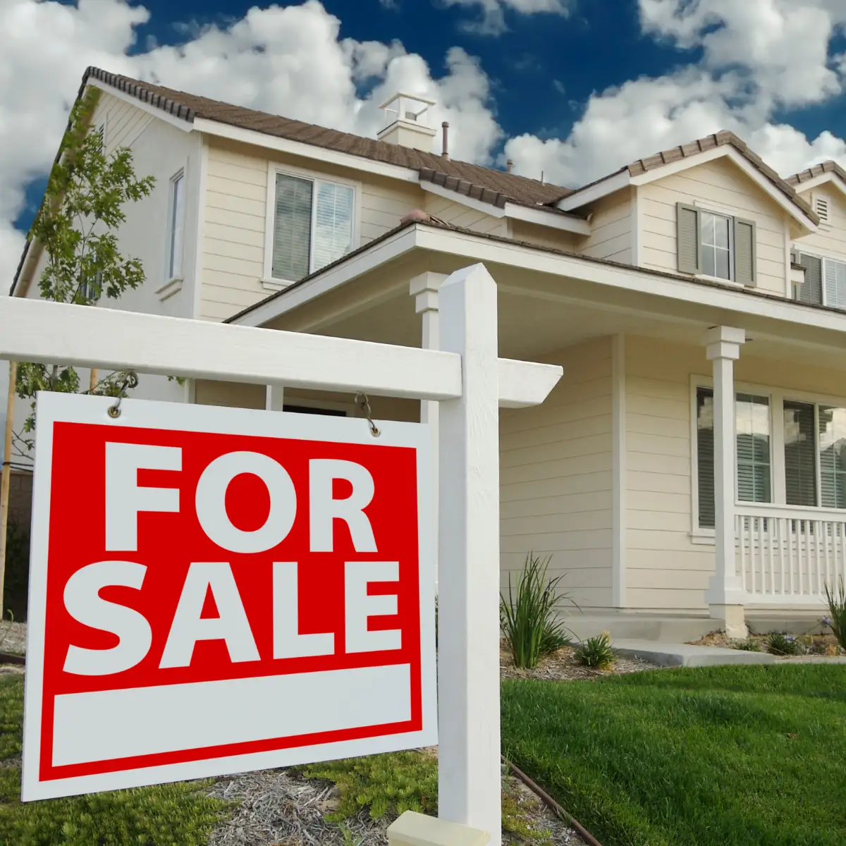 home with for sale sign in front