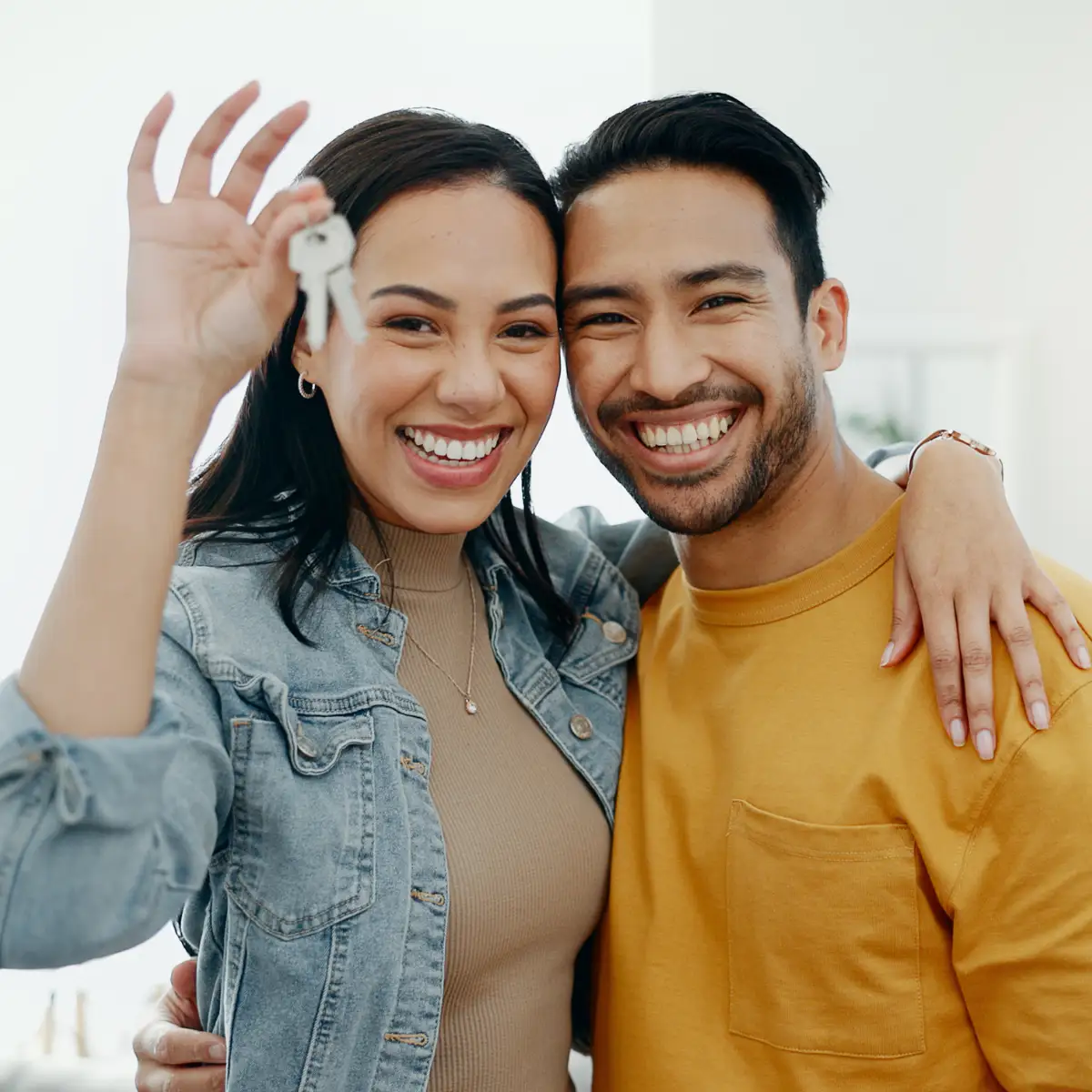 couple holding house keys