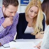 man and woman reviewing mortgage insurance documents