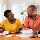 Man and woman reviewing mortgage paperwork