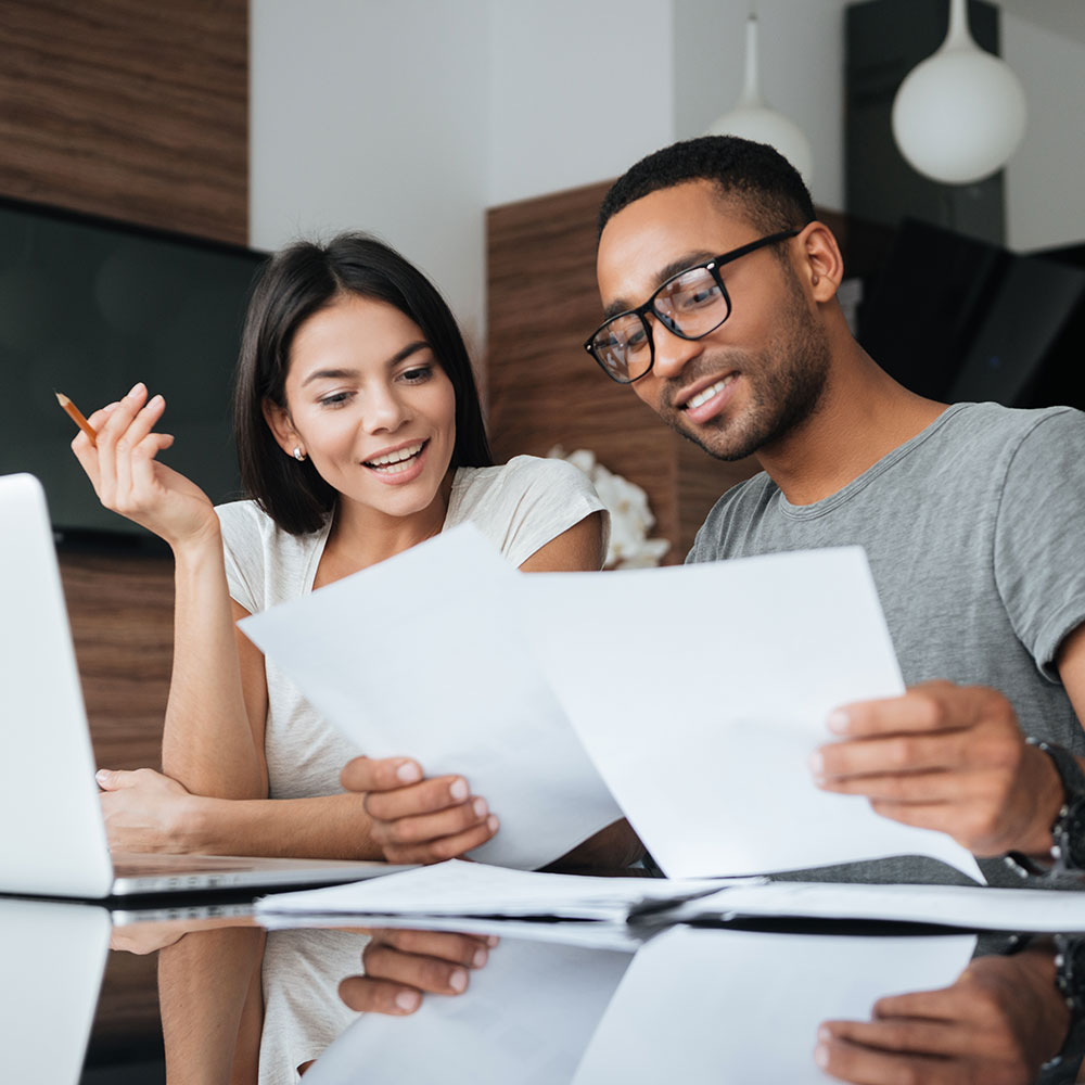 couple reviewing mortgage amortization schedules